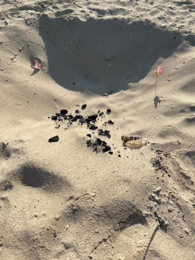 Fig. 8 Waste and charcoal dumped in turtle nest. © Amani Al-Zaidan, Abdullah Al-Zaidan, Hamad Al-Qadaifi, KEPA
