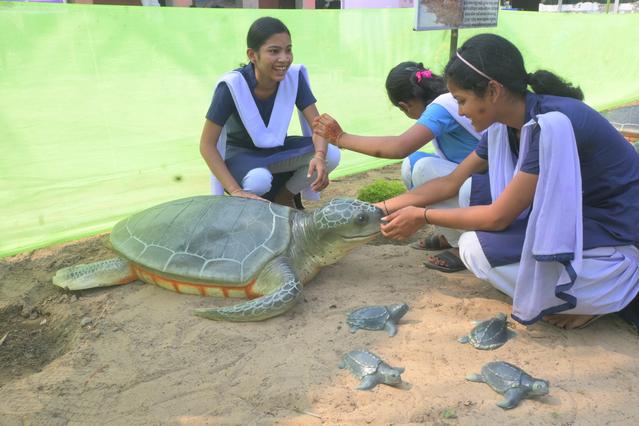 School children with turtle sculptures