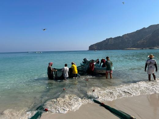 Fishermen Hauling in Nets